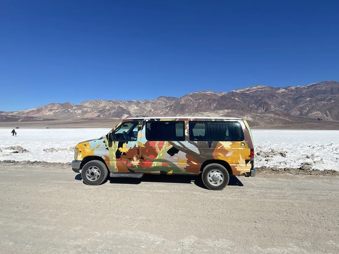 Gertrude, the autumn-painted 2008 Ford Econoline camper van, full side profile