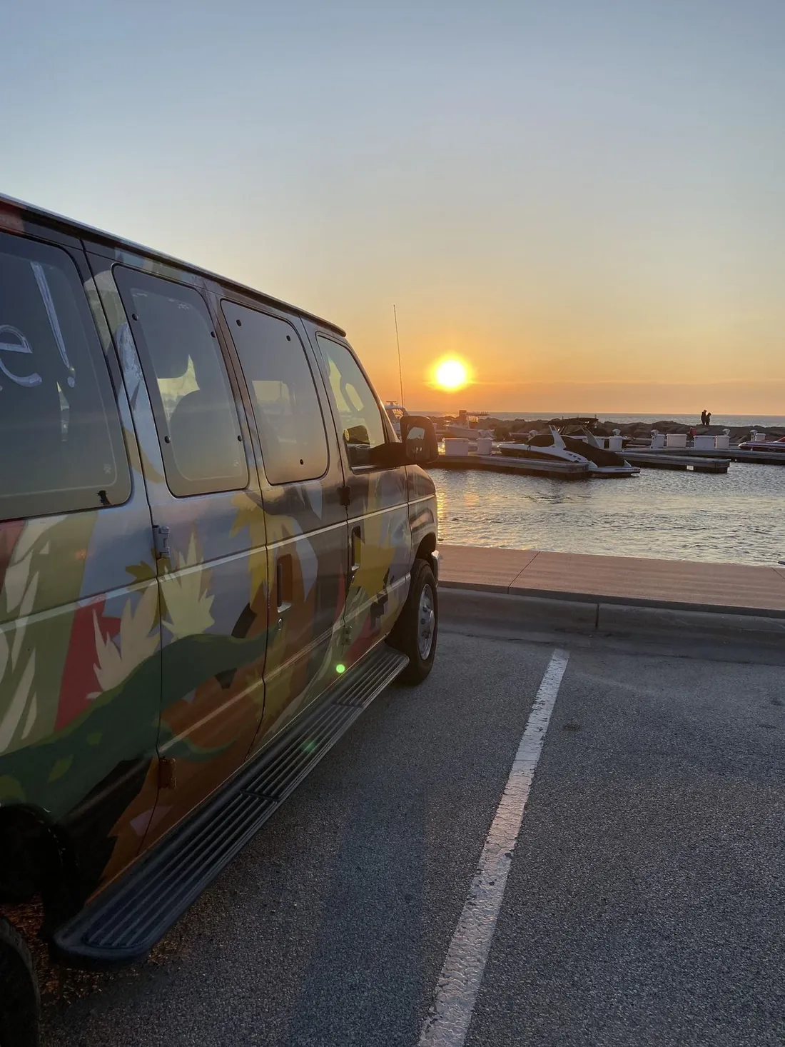 Gertrude parked at the marina at sunset