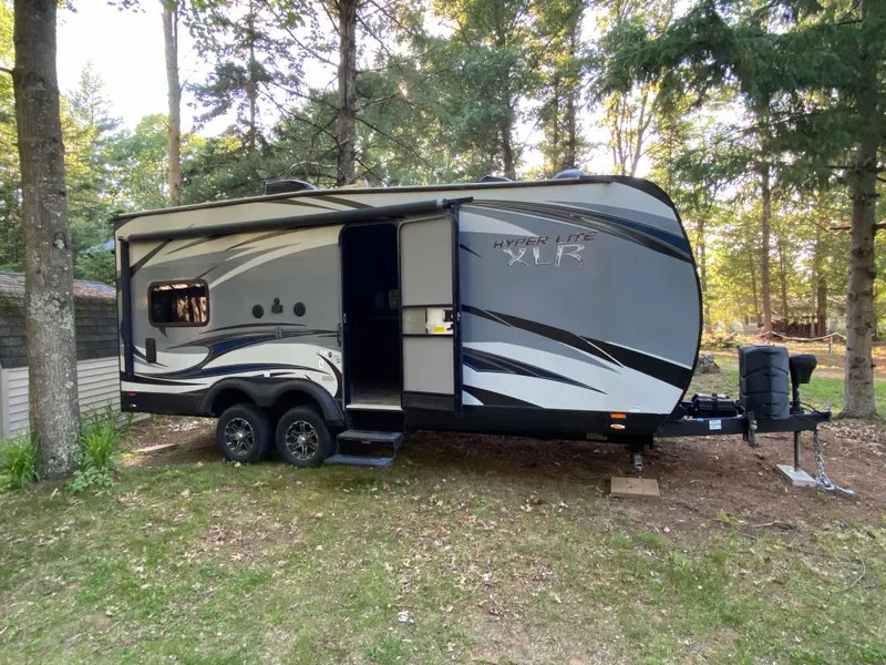 The Trailer, a family-sized camper we deliver and set up at your campsite
